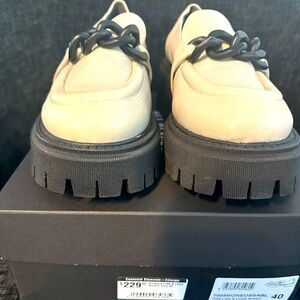 Cream Loafer with Black Chunky Sole and Black Hardware Chain.